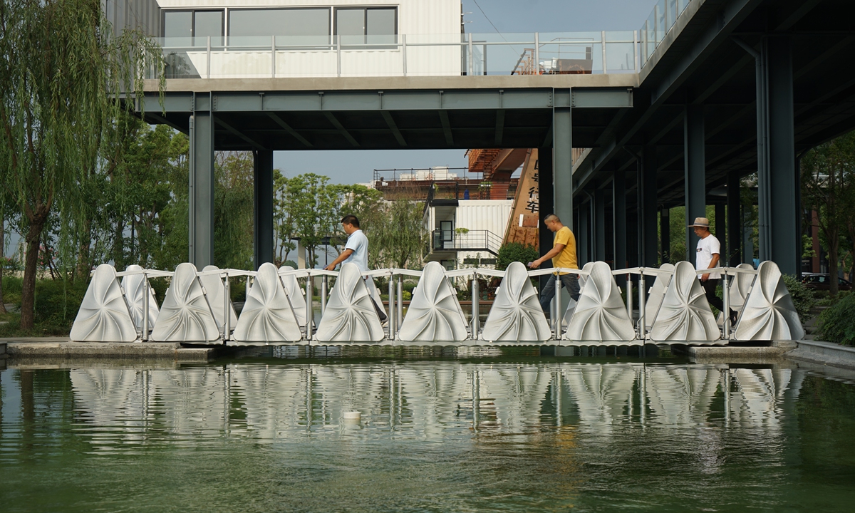People pass by the 3D-printed retractile bridge in Shanghai on Monday. Photo: Global Times